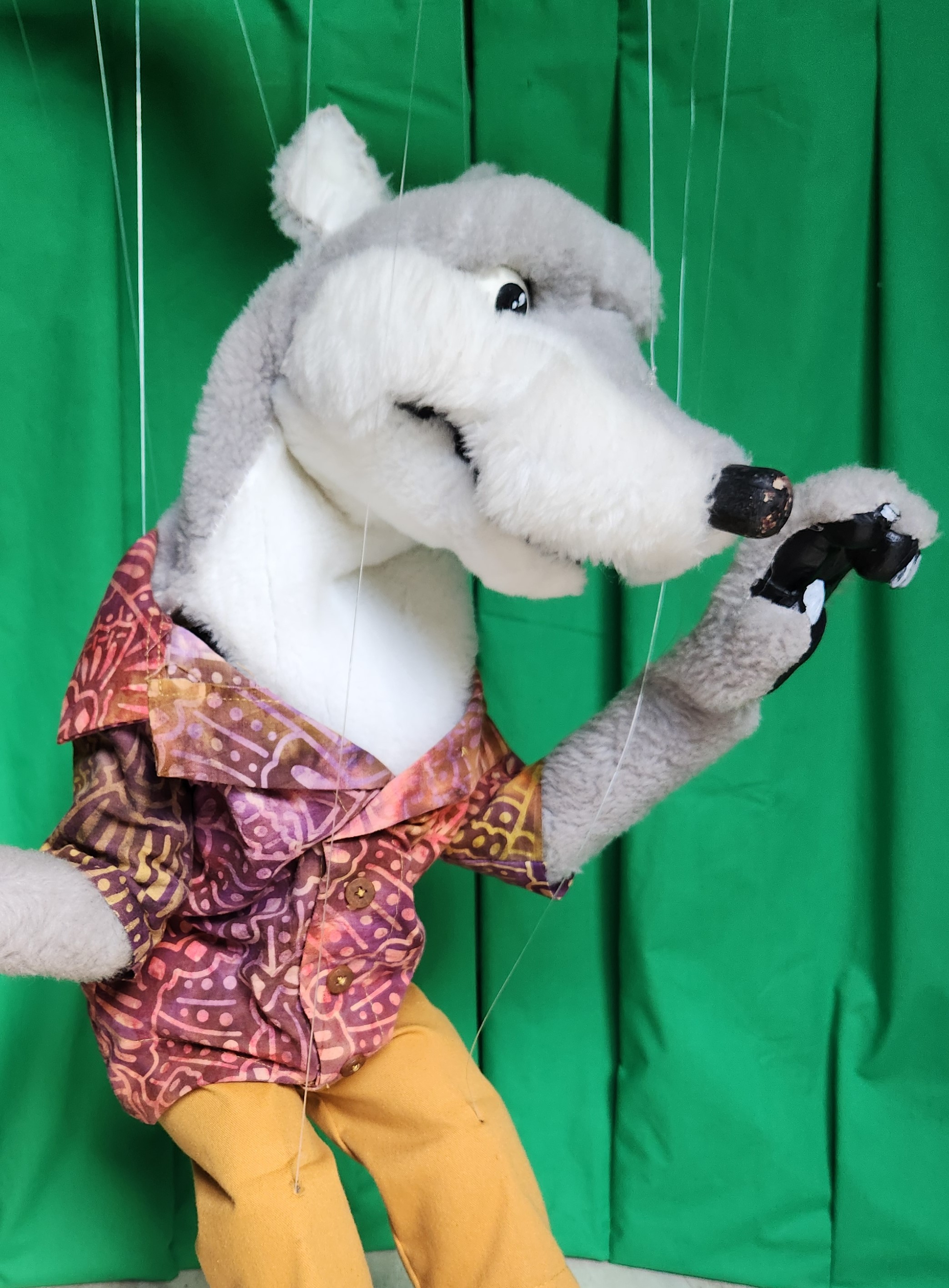 puppet of the big bad wolf in a loud Hawaiian shirt