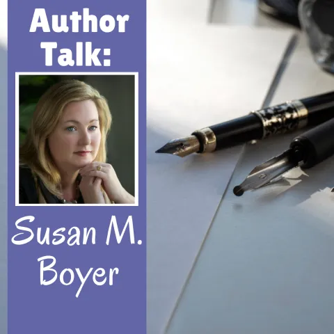 background of dip pens with a ribbon border with picture of Susan M. Boyer